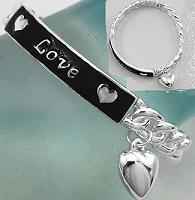 Silver Love strech bracelet with black epoxy accent with silver heart charm. Links are molded together. Lead compliant.